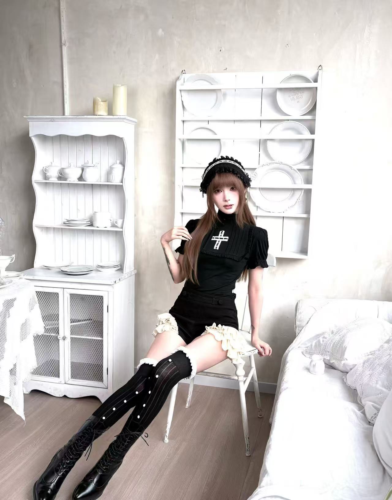 Black gothic bloomer shorts styled with thigh high stockings and platform heels