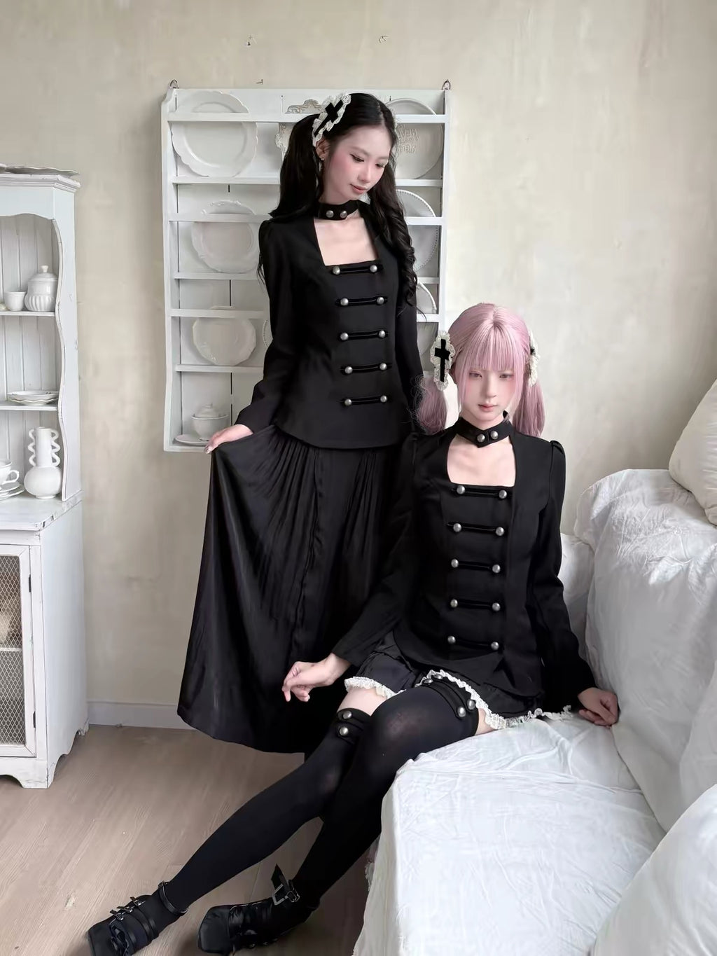 Two models styling black gothic alternative outfits